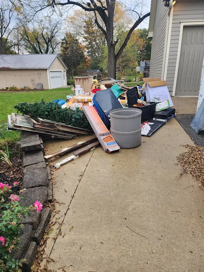 Dumpster being loaded with debris for Commercial Dumpster Rental in Cold Spring